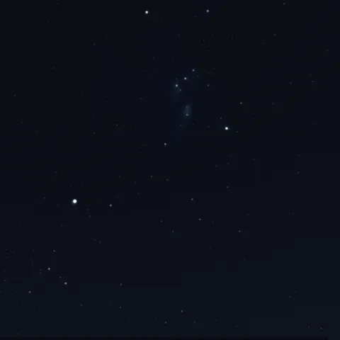 Meteors streaking from one point in a night sky